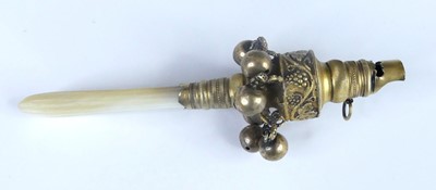 Lot 1142 - A Georgian silver-gilt baby's rattle, having...
