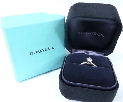 Lot 2565 - A Tiffany platinum diamond solitaire ring,...