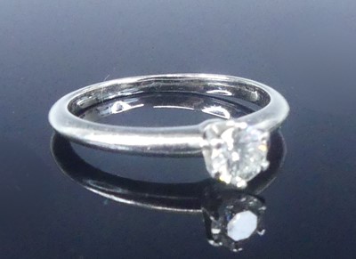 Lot 2565 - A Tiffany platinum diamond solitaire ring,...