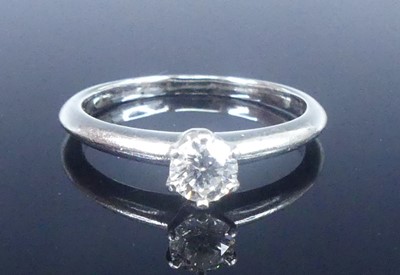 Lot 2565 - A Tiffany platinum diamond solitaire ring,...