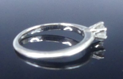 Lot 2565 - A Tiffany platinum diamond solitaire ring,...