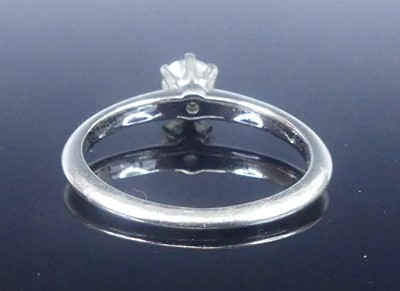 Lot 2565 - A Tiffany platinum diamond solitaire ring,...