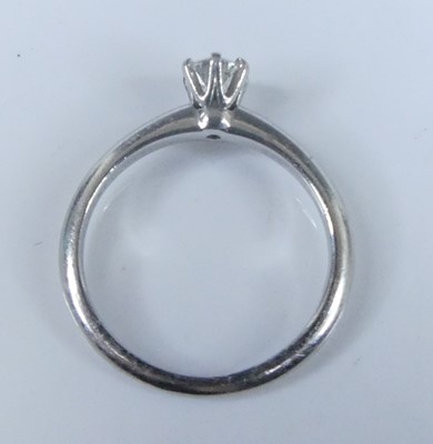 Lot 2565 - A Tiffany platinum diamond solitaire ring,...