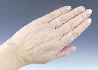 Lot 2565 - A Tiffany platinum diamond solitaire ring,...