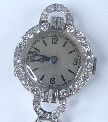 Lot 2571 - A white metal Art Deco diamond set manual wind...
