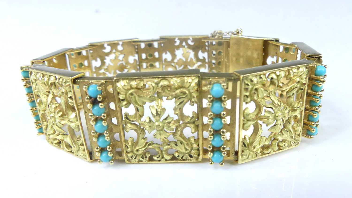 Lot 2575 - A yellow metal rectangular scrollwork panel...