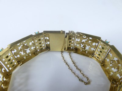 Lot 2575 - A yellow metal rectangular scrollwork panel...