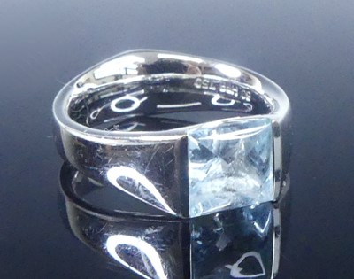 Lot 2624 - A white metal blue topaz single stone ring,...