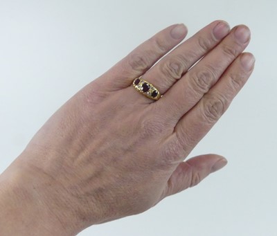 Lot 2584 - An 18ct yellow gold, ruby and diamond half...