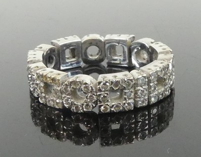 Lot 2632 - A white metal diamond eternity ring, featuring...