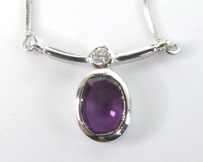 Lot 2645 - A white metal pink sapphire and diamond...