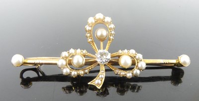 Lot 2646 - A yellow metal diamond and pearl bar brooch in...