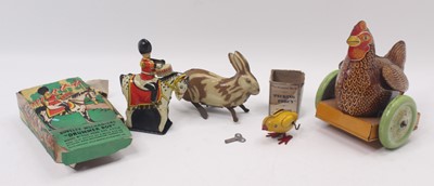 Lot 1955 - Four tinplate clockwork 1950s toys to include...