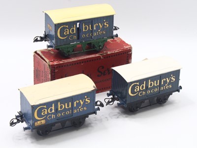 Lot 163 - Three Hornby 0 gauge Cadbury's Chocolate vans,...