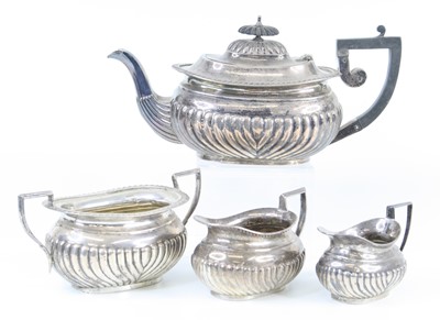 Lot 1130 - An Edwardian silver three-piece tea service,...