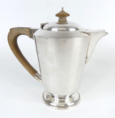 Lot 99 - A late Art Deco silver footed coffee pot, with...