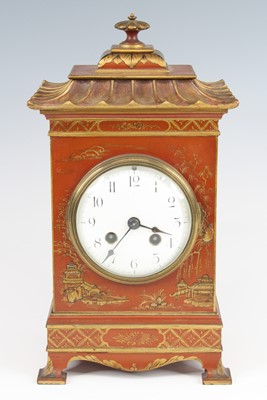 Lot 1358 - A George V mantel clock, the red lacquered...