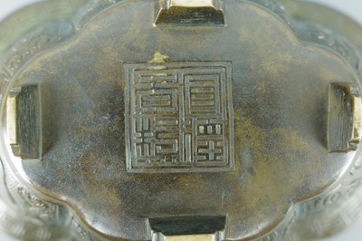 Lot 2071 - A pair of Chinese bronze quatrefoil-shaped...