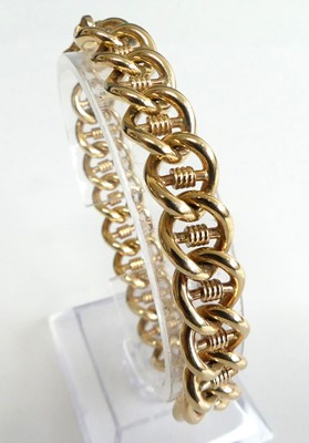 Lot 2598 - A modern 9ct gold fancy curblink bracelet,...