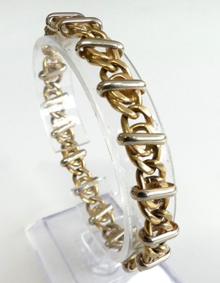 Lot 2601 - A modern 9ct gold heavy curblink bracelet,...