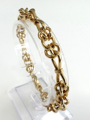 Lot 2602 - A modern heavy 9ct gold knot link bracelet,...