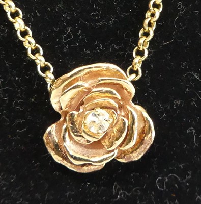 Lot 2682 - A 9ct gold diamond set pendant, arranged as a...