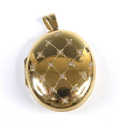 Lot 2615 - A contemporary 9ct gold diamond set oval...