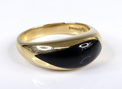 Lot 2618 - A contemporary 9ct gold and polished black...