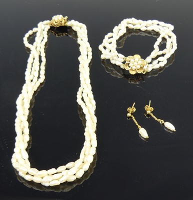 Lot 2628 - A contemporary rice pearl choker, arranged as...