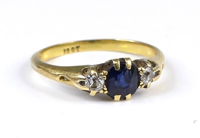 Lot 2604 - An 18ct gold sapphire and diamond three-stone...