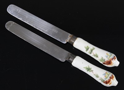 Lot 1064 - A pair of Continental porcelain handled table...