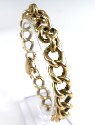 Lot 2729 - A 9ct gold hollow curblink bracelet, having...