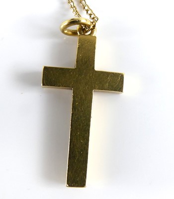 Lot 2737 - A modern yellow metal cross pendant, stamped...
