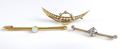 Lot 2741 - A 15ct gold cabochon opal set safety pin bar...