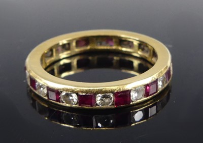 Lot 2675 - A yellow metal ruby and diamond eternity ring...