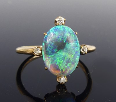 Lot 2676 - A rose metal opal and diamond dress ring, the...