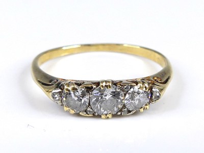 Lot 2687 - A yellow metal diamond 3 stone ring featuring...