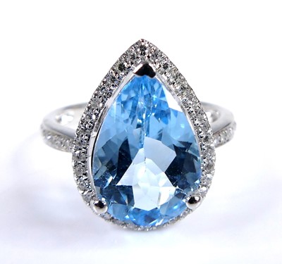 Lot 2712 - A white metal blue topaz and diamond...