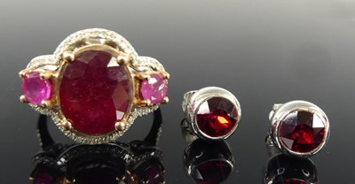 Lot 2714 - A white metal ruby and diamond triple cluster...