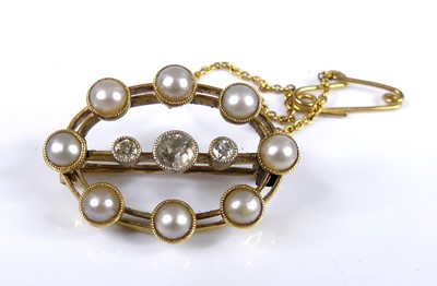 Lot 2717 - A yellow metal pearl and diamond oval openwork...