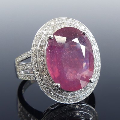Lot 2721 - A white metal ruby and diamond oval cluster...
