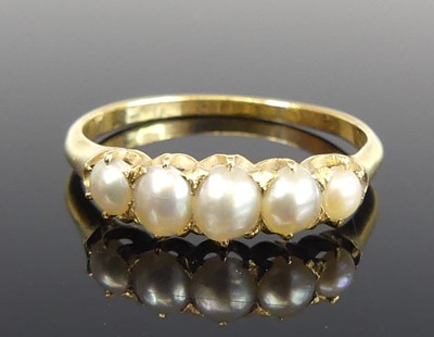 Lot 2744 - An antique yellow metal pearl set half-hoop...