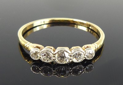 Lot 2747 - An 18ct gold and diamond five-stone half-hoop...