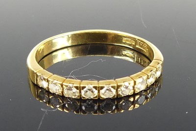 Lot 2808 - An 18ct gold diamond half-hoop ring, arranged...
