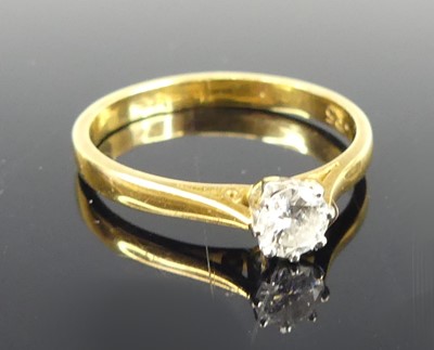 Lot 2806 - An 18ct gold diamond solitaire ring, the claw...