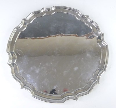 Lot 1124 - A George V silver salver, of shaped circular...