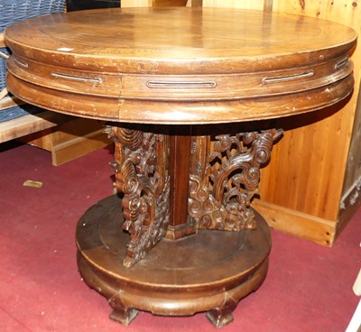 Lot 1316 - A Chinese stained elm circular pedestal centre...
