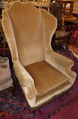 Lot 1332 - An early 20th century wing back scroll...