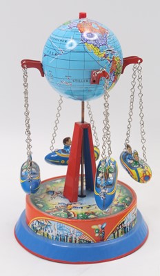 Lot 1935 - A West German clockwork wind-up globe Tinplate...