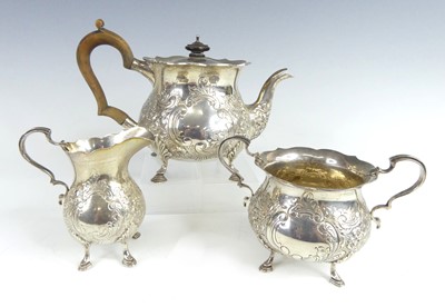 Lot 1136 - An Edwardian silver three-piece tea service,...